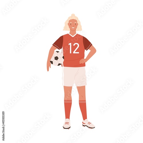 Young female football or soccer player standing and holding ball in hand. Smi...