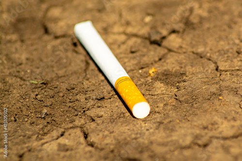 Cigarette on the ground closeup, picture for design