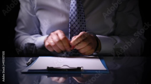 handcuffed offender testifies. A male criminal writes a confession to the crime.Sincere recognition.Criminal interrogation at the police station.Criminal confessed.