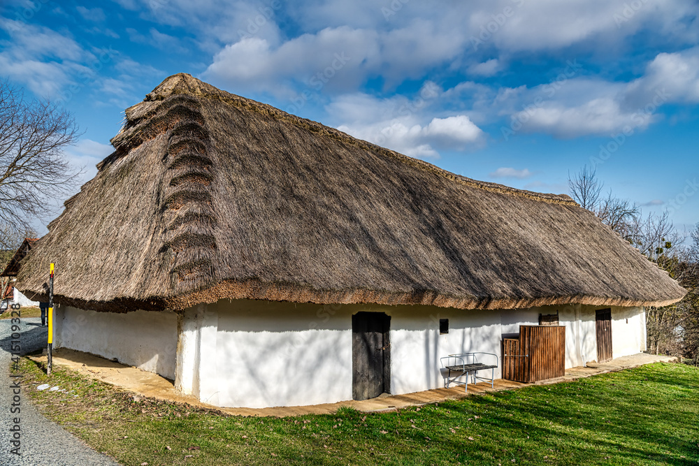 Thatched roof, of a wine press house in Heiligenbrunn in Burgenland. This Wine Cellar Alley is one of the most beautiful Kellergasse in Burgenland and Austria. 13.02.2021 Thatched roof, of a wine press house in Heiligenbrunn in Burgenland. This Wine Cellar Alley is one of the most beautiful Kellergasse in Burgenland and Austria. 13.02.2021