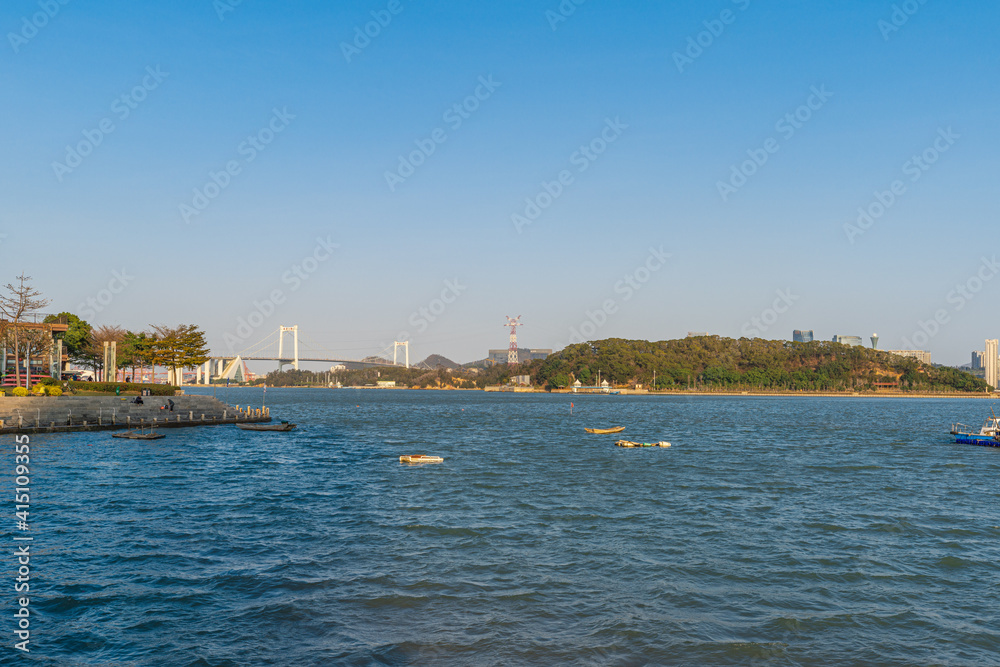 Xiamen Haicang Bay Park landscapes of the sea in Xiamen City, and Haicang Bridge at distance