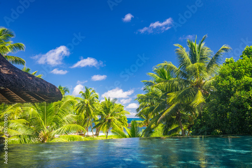 A tropical view from a pool on Praslin island resort, Seychelles