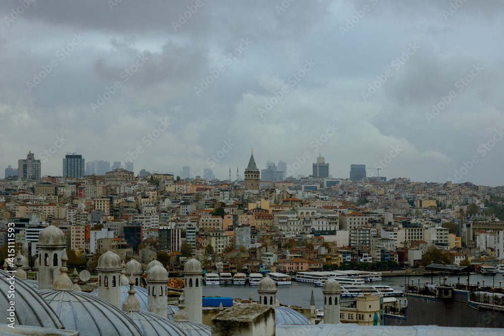 Cityscape of Istanbul with Galata Tower at cloudy sky