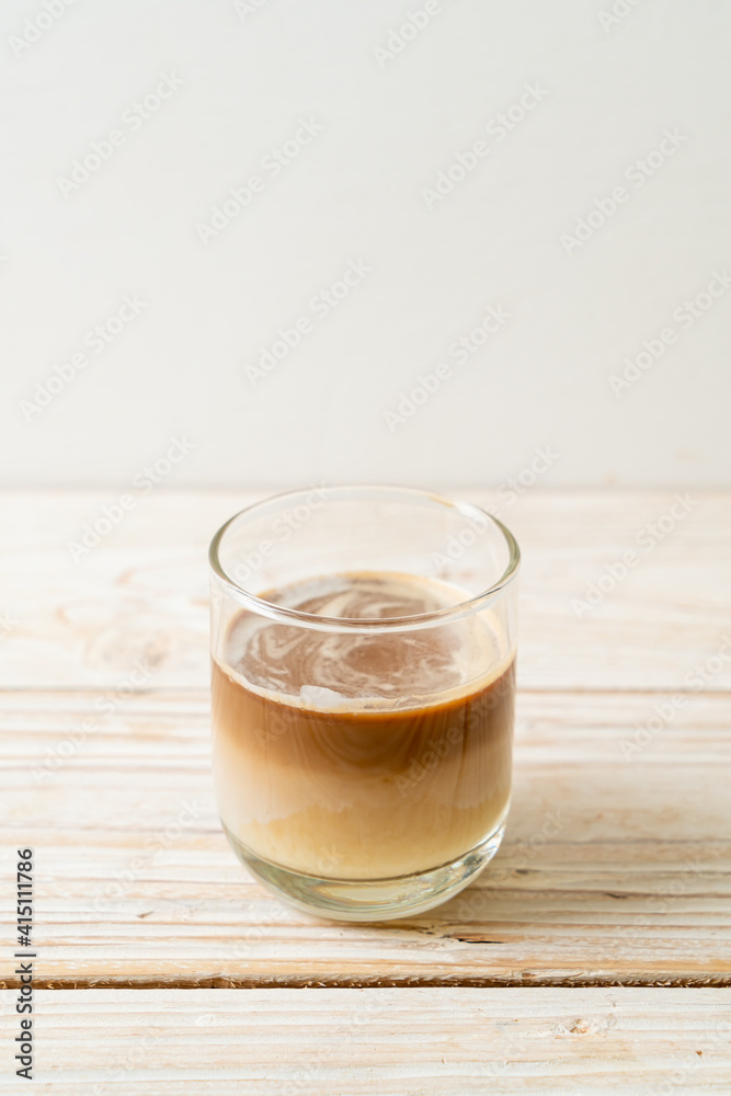 Dirty coffee, cold milk topped with hot espresso coffee shot Dirty coffee, cold milk topped with hot espresso coffee shot