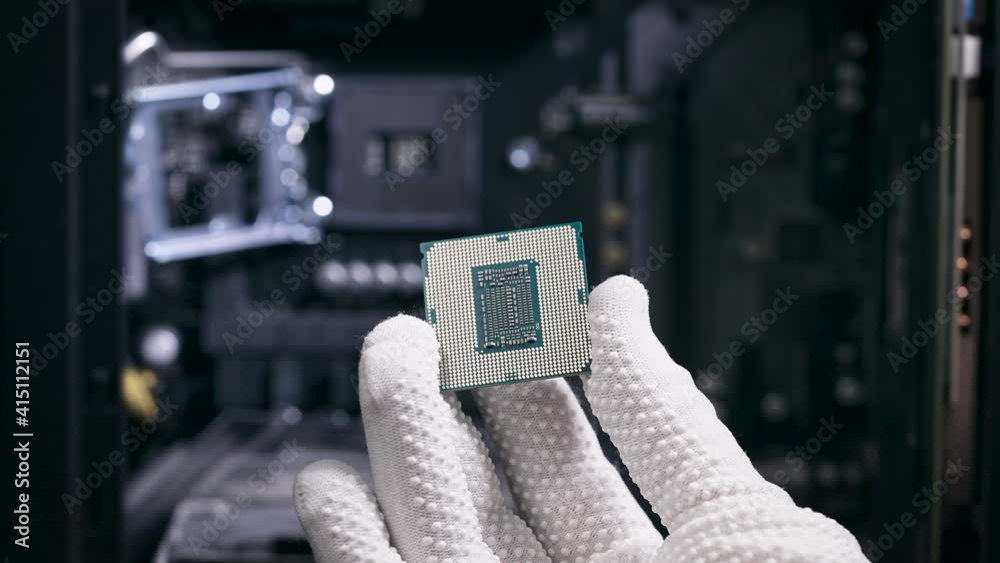 The hand holds the central processing unit. The processor is ready to ...