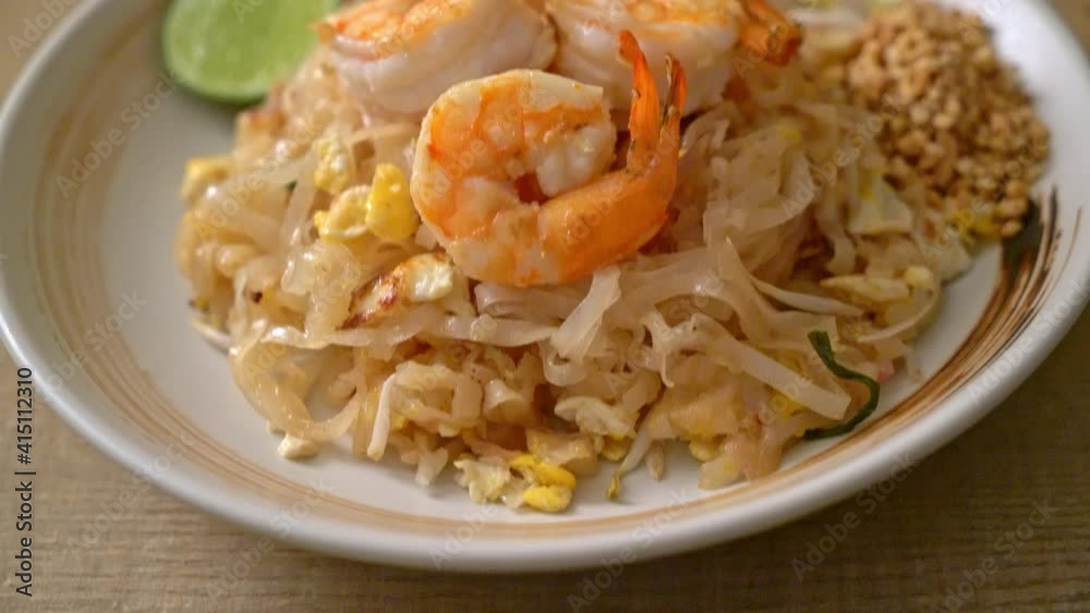 stir-fried noodles with shrimp and sprouts or Pad Thai - Asian food style stir-fried noodles with shrimp and sprouts or Pad Thai - Asian food style