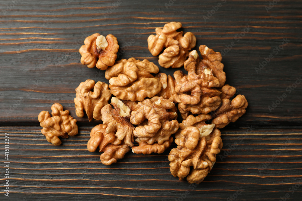 Heap of tasty walnuts on wooden background Heap of tasty walnuts on wooden background