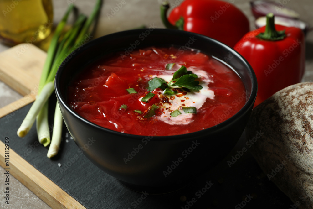 Concept of tasty eating with borscht on gray background Concept of tasty eating with borscht on gray background