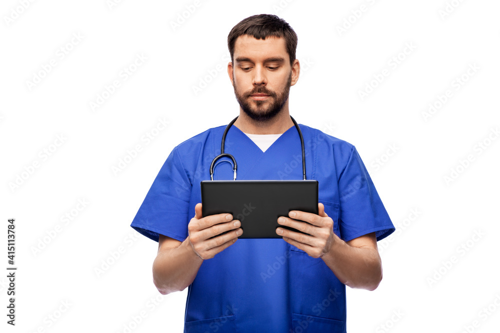 medicine, healthcare and technology concept - doctor or male nurse in blue uniform with stethoscope using tablet pc computer over white background medicine, healthcare and technology concept - doctor or male nurse in blue uniform with stethoscope using tablet pc computer over white background