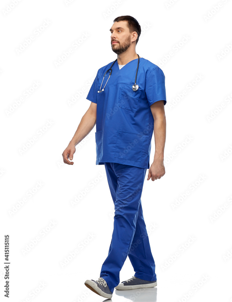 healthcare, profession and medicine concept - doctor or male nurse in blue uniform with stethoscope walking over white background healthcare, profession and medicine concept - doctor or male nurse in blue uniform with stethoscope walking over white background