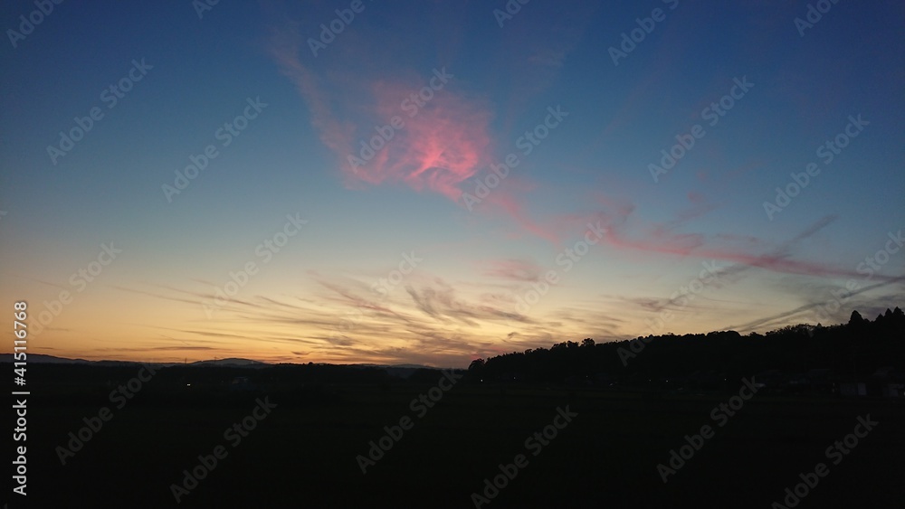 Sunset with rose-coloured cloud