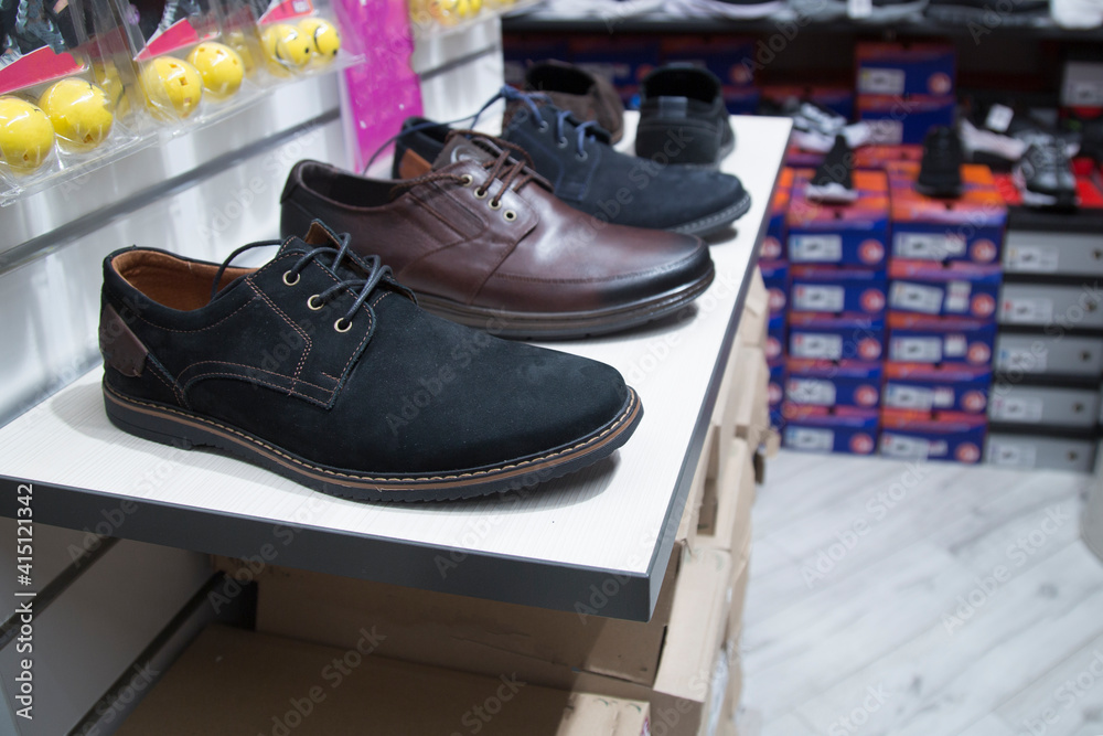 A shoe store. Shoes on the store counter.