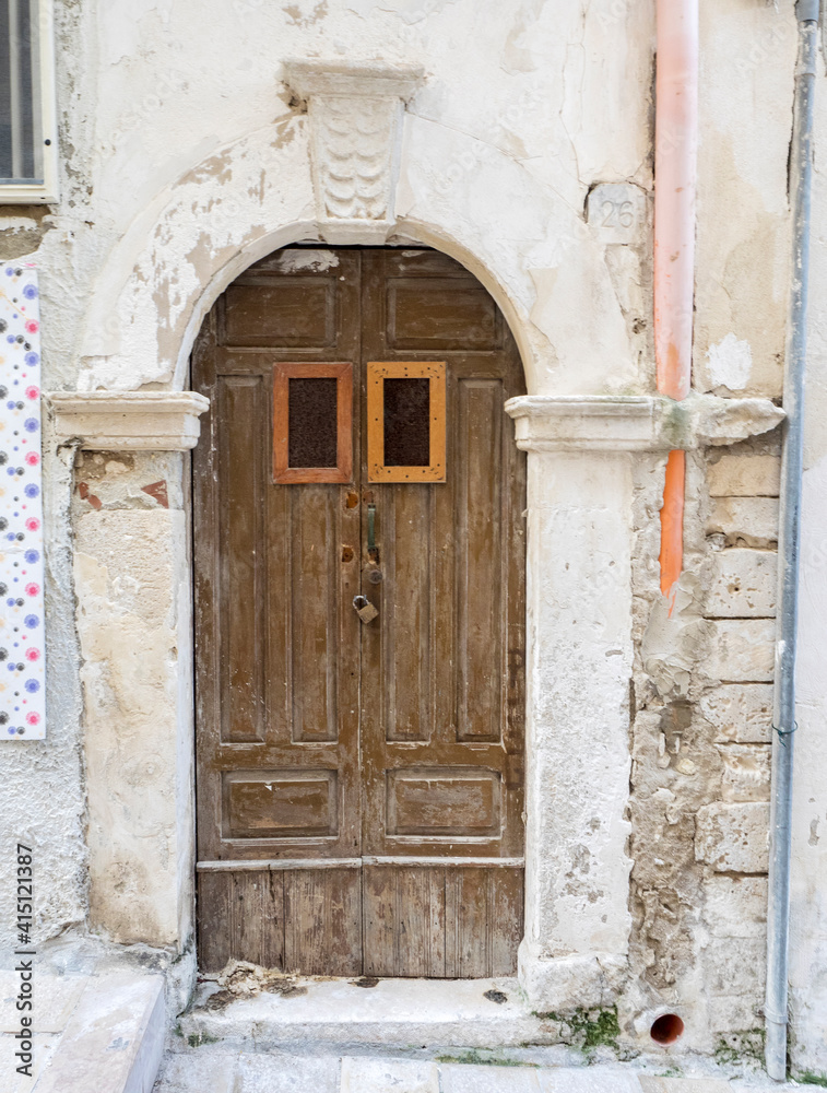 Old wooden door along the streets of Vieste.