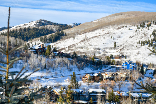 View overlooking snow topped vacation homes in the Park City ski area in Utah during winter