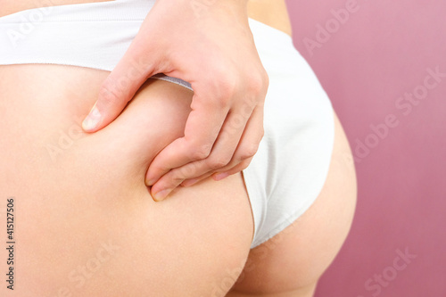 Wallpaper Mural Close up view of a slender woman in lingerie on a pink background. Torontodigital.ca