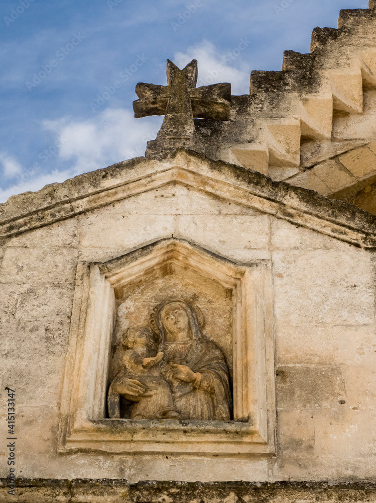 Carving on a small chapel in old town Matera.