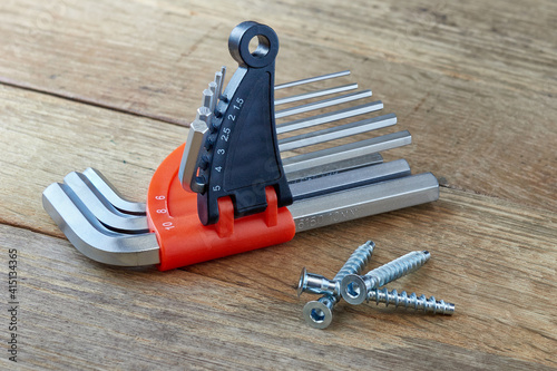 An image of a furniture set of keys for a screw, a confirmation - which are used for screeds, furniture assembly.