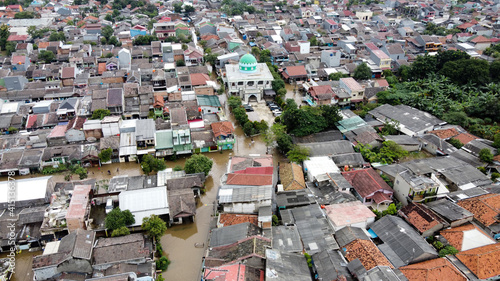 Aerial POV view Depiction of flooding. devastation wrought after massive natural disasters.  © syahrir