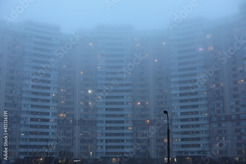 city skyline at night. View of residential skyscraper on a cloudy day. Modern cityscape of Ukrainian capital. Design of contemporary build in big city. Real urban style of residential building.