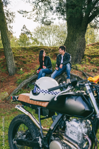Couple resting from a motorcycle trip