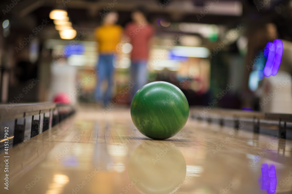 Young couple having fun in bowling alley. Young couple having fun in bowling alley.