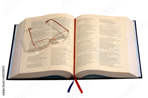 Eyeglasses lying on an old book