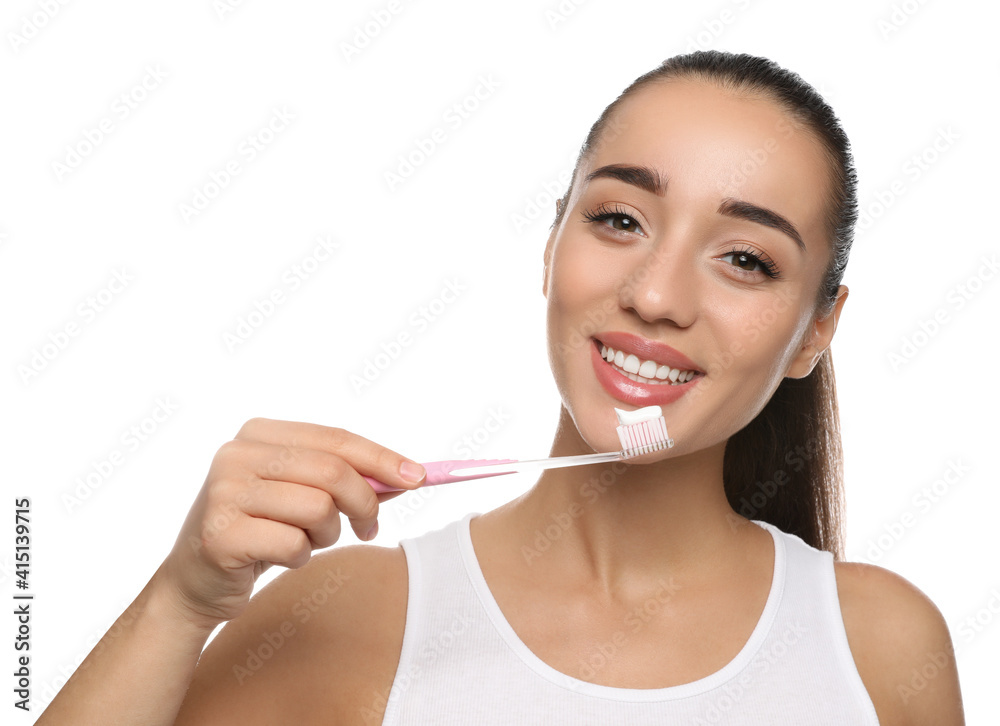 Woman holding toothbrush with paste on white background Woman holding toothbrush with paste on white background
