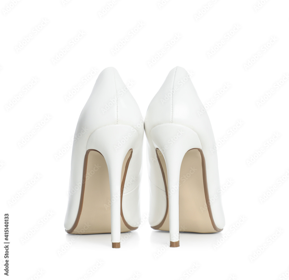 Beautiful classic wedding shoes on white background, back view