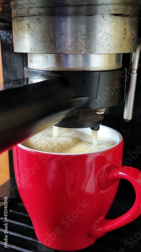 espresso machine with red cup