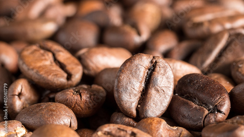 Macro photo of roasted arabica coffee beans.