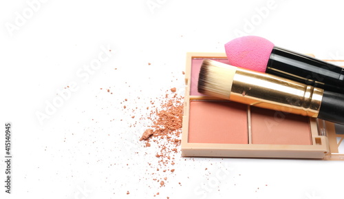 Makeup palette and powder pile with cosmetic applicator brush set isolated on white background