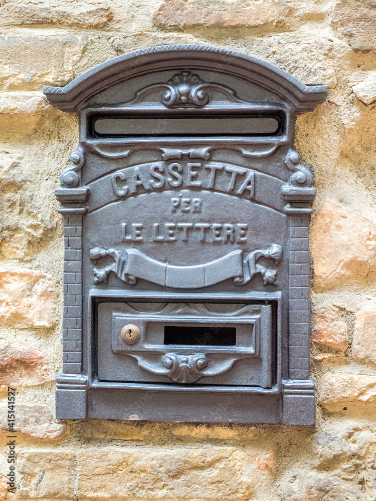 Europe, Italy, Chianti. Letter box on the stone wall of a home in the town of San Gimignano.