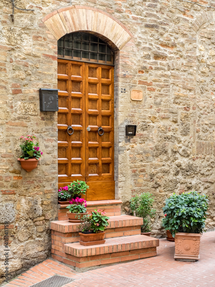 Europe, Italy, Chianti. Doorway to a home decorated with potted plants on the steps.