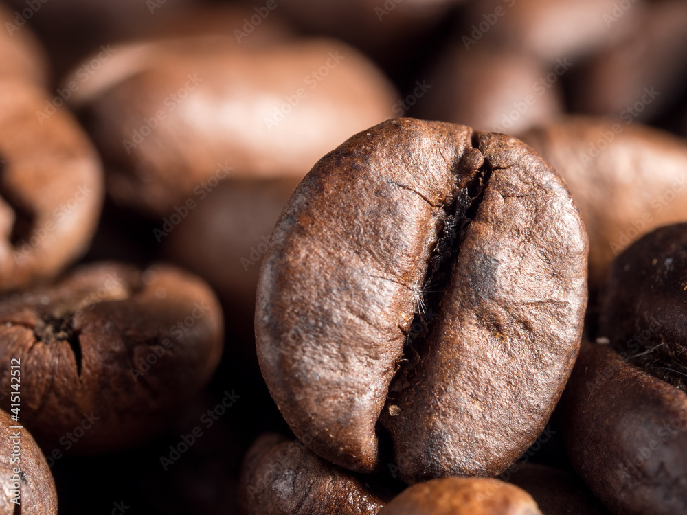 Fototapeta premium Macro photo of roasted arabica coffee beans.