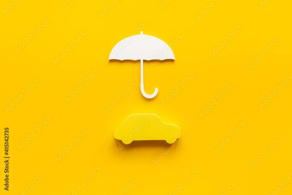Buy car insurance concept. Car shape under umbrella Buy car insurance concept. Car shape under umbrella