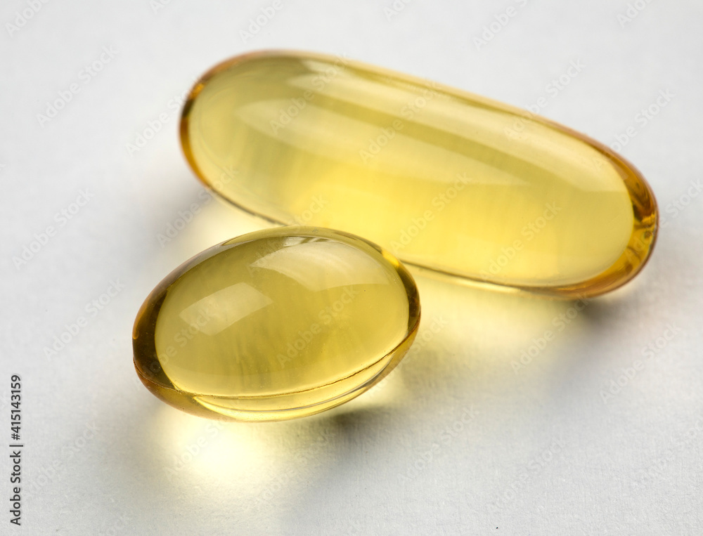 Omega 3 capsules on white background. Health care concept. Omega 3 capsules on white background. Health care concept.