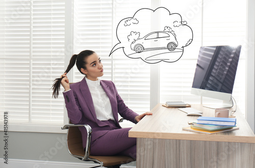 Bilde på lerret Young woman dreaming about new car in office