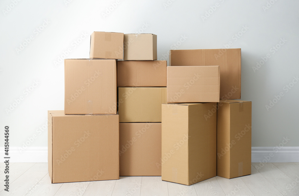 Cardboard boxes with stuff indoors. Moving day Cardboard boxes with stuff indoors. Moving day