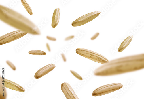 Raw rice levitates on a white background