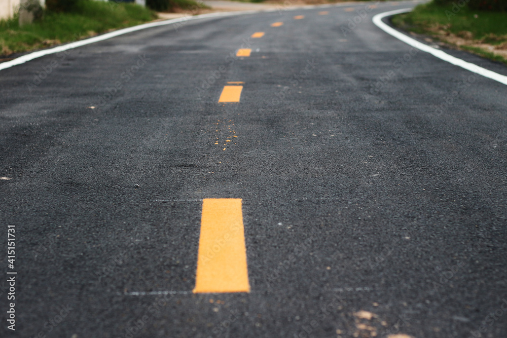 black asphalt winding road transport with white and yellow line black asphalt winding road transport with white and yellow line