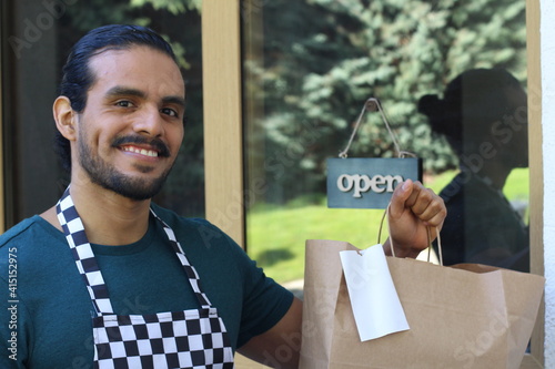 Worker holding paper bad with receipt  