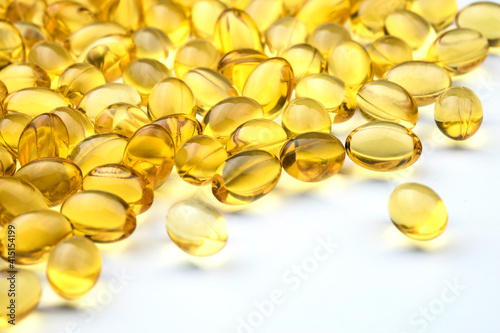 Bunch of fish oil capsules as background.