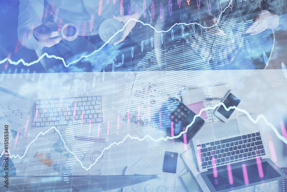 Double exposure of man and woman working together and financial chart hologram drawing. market analysis concept. Computer background. Top View. Double exposure of man and woman working together and financial chart hologram drawing. market analysis concept. Computer background. Top View.