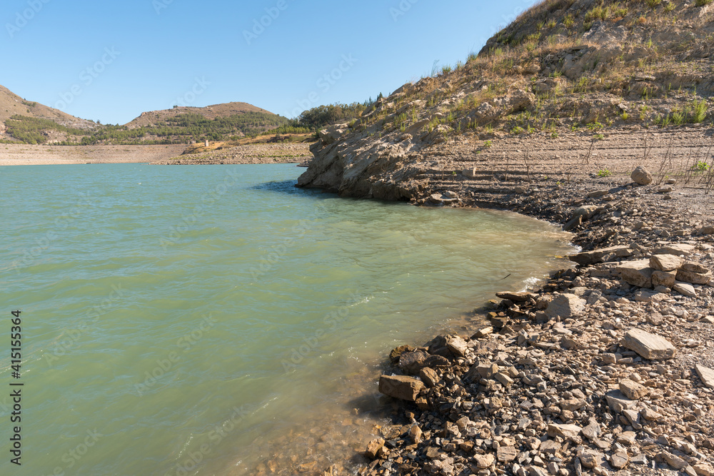 Beninar reservoir between mountains in southern Spain