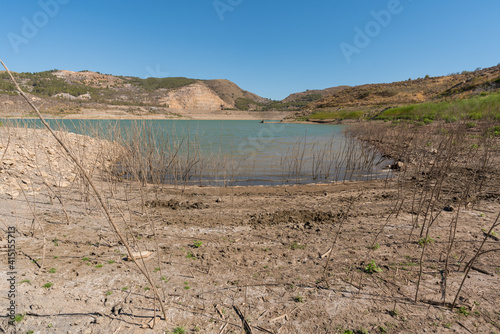 Beninar reservoir between mountains in southern Spain photo