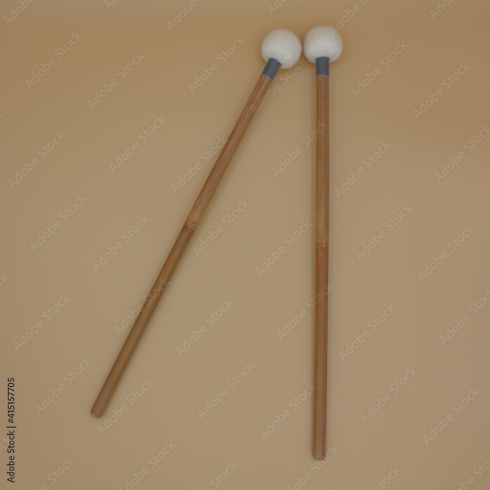 Timpani mallets on a cream background. Timpani mallets on a cream background.