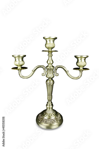Triple bronze candelabrum with three candlesticks, isolated on white background.