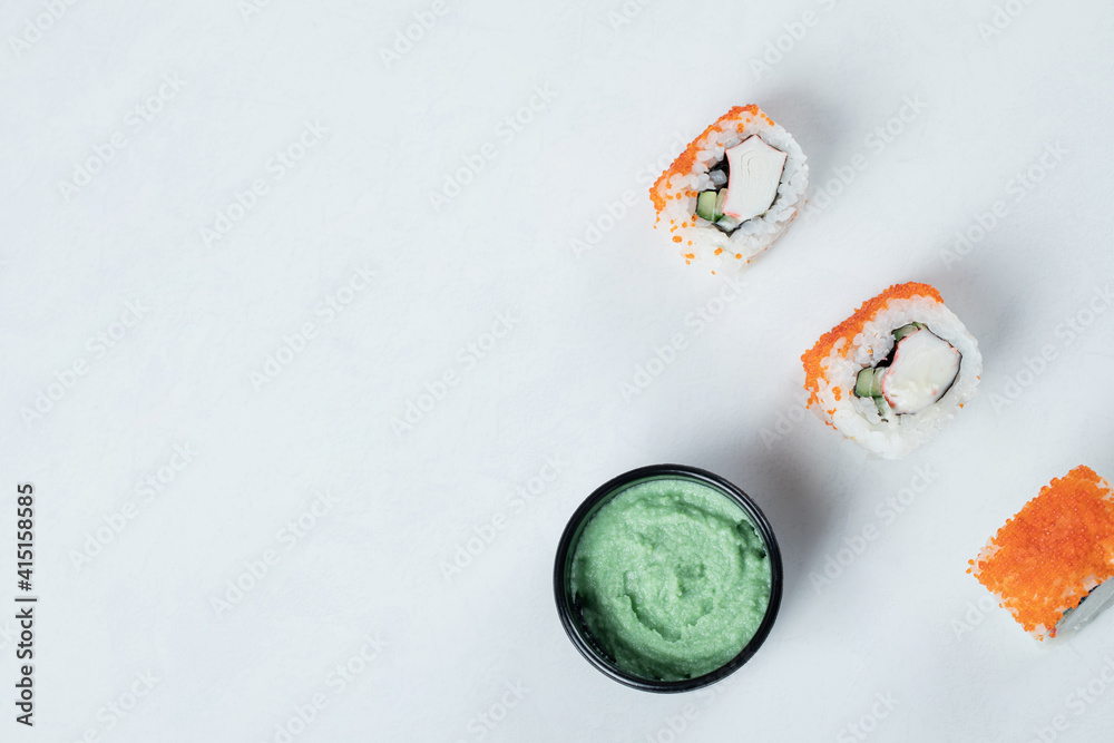 Maki sushi rolls with red caviar served with wasabi sauce Maki sushi rolls with red caviar served with wasabi sauce