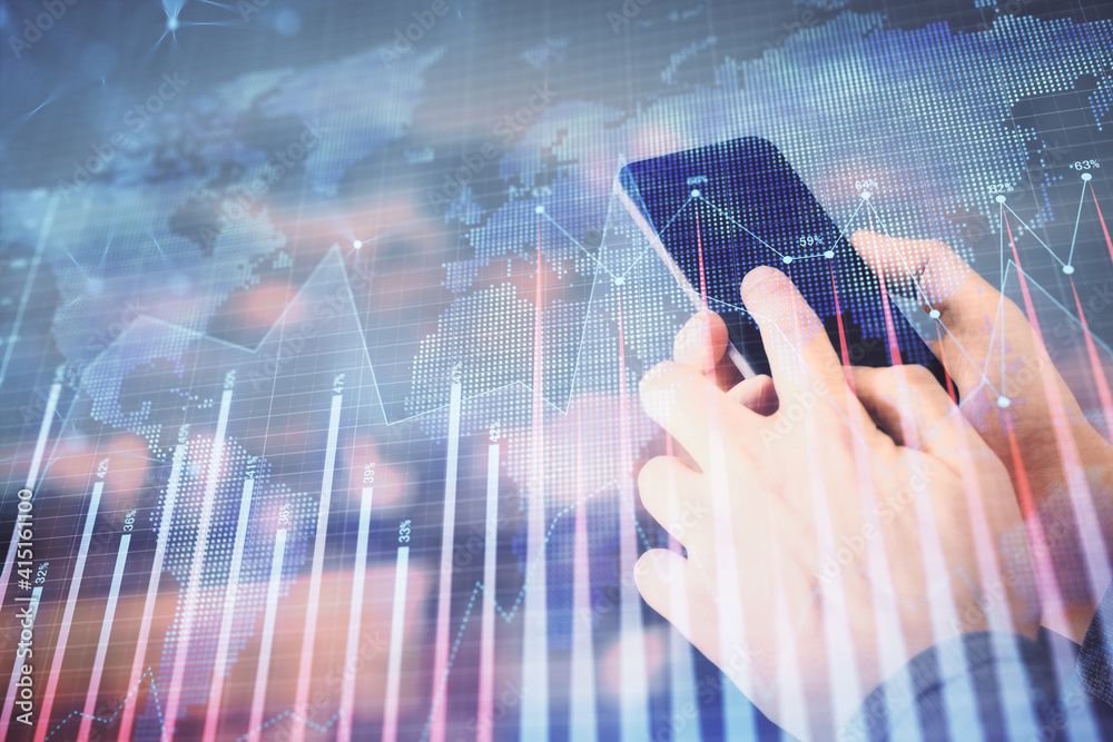 Double exposure of man's hands holding and using a digital device and forex graph drawing. Financial market concept. Double exposure of man's hands holding and using a digital device and forex graph drawing. Financial market concept.