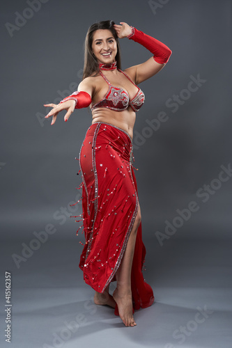 Arab belly dancer on gray background
